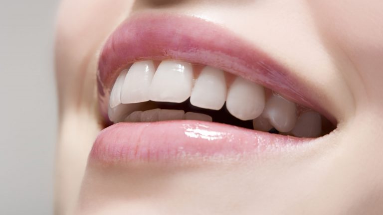 Woman wearing lip gloss