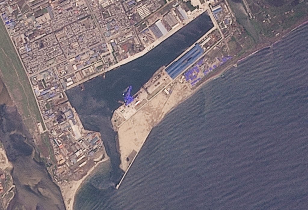 A satellite image shows the North Korean warship in water at shipyard after the launch accident