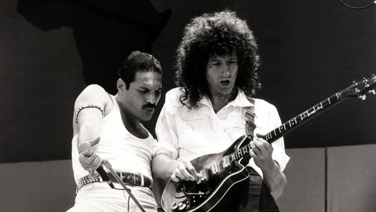 Entertainment/Music. Live Aid Concert. Wembley, London, England. 13th July 1985. British singer Freddie Mercury with guitarist Brian May as "Queen" perform at the charity concert.